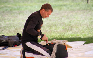 07-parachute-packing-rigging-area Parachute packing and preparation before tandem skydiving