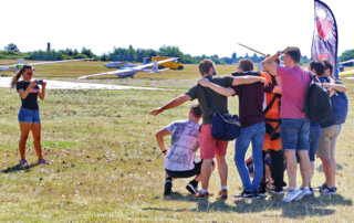12-tandem-skydive-bachelor-party-dropzone Tandem skydive passenger with friends during a bachelor party at the drop zone