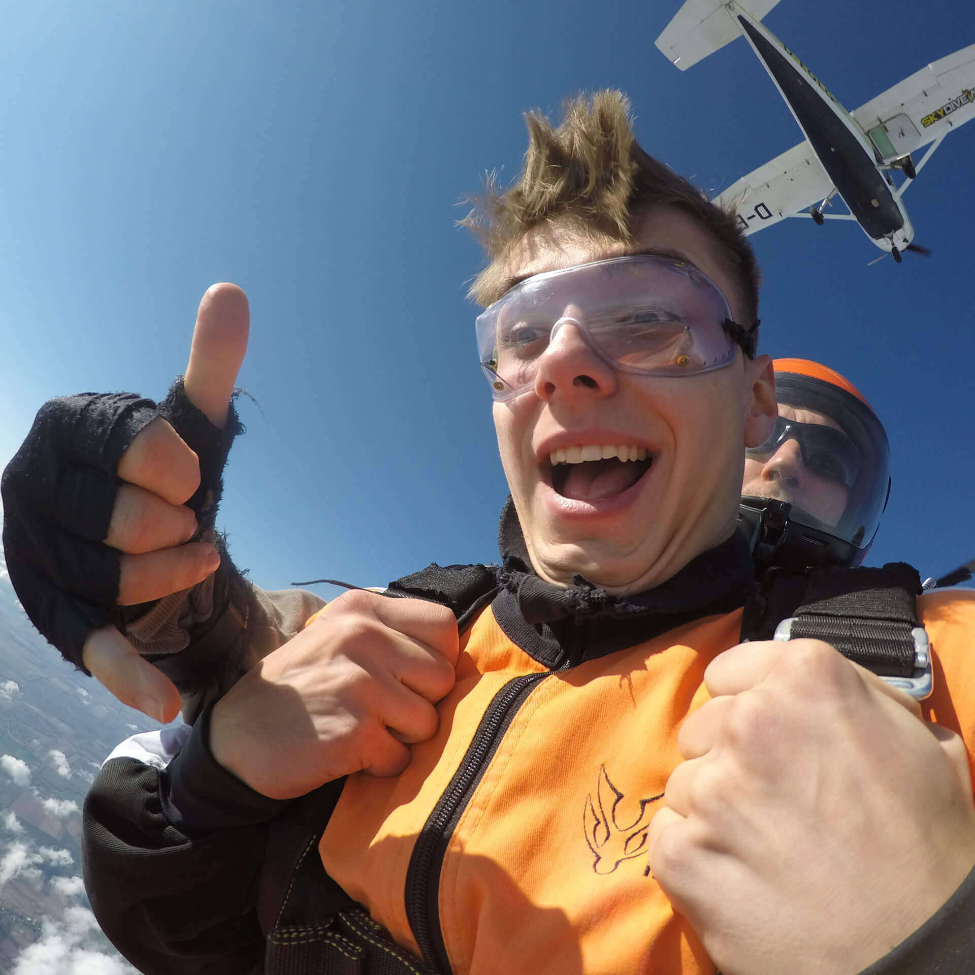 tandem-skydiving-prices-near-budapest-freefall-hero-m Tandem skydiving prices near Budapest with happy passenger during freefall